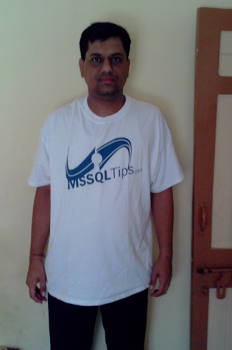 Pratik Patel at home in his MSSQLTips.com t-shirt.