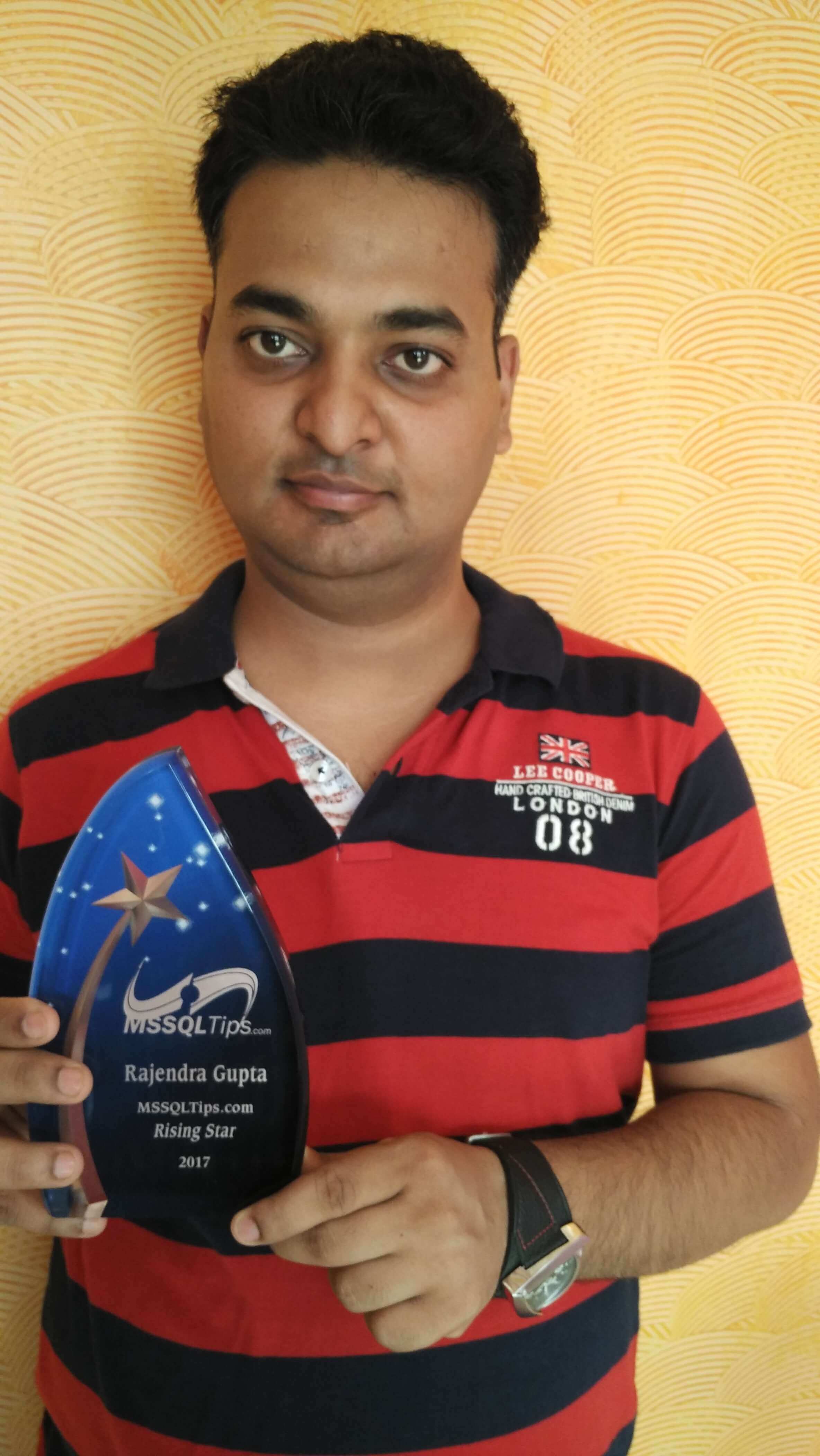 Rajendra Gupta proudly holding his 2017 Rising Sta